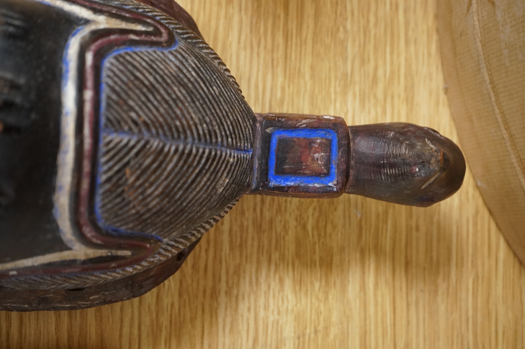 A carved African Ivory Coast mask, 39cm high